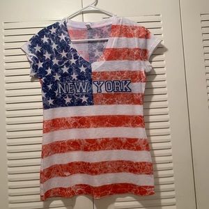 Red, blue and white top.